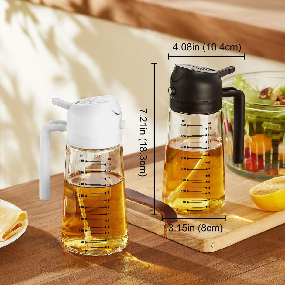 Glass olive oil dispenser misting an air fryer basket